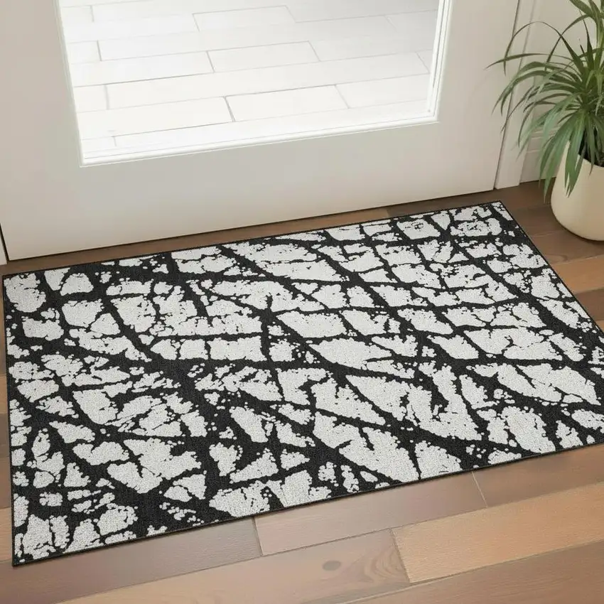 Black And Ivory Abstract Washable Area Rug With UV Protection Photo 2