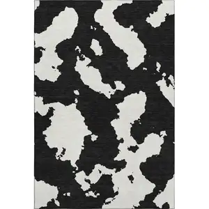 Photo of Black And Ivory Abstract Washable Area Rug With UV Protection
