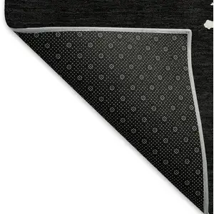 Photo of Black And Ivory Abstract Washable Area Rug With UV Protection