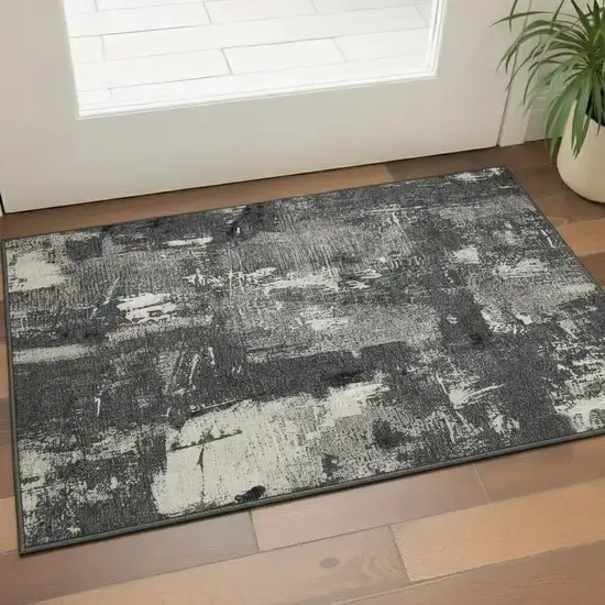 Black And Ivory Abstract Washable Area Rug With UV Protection Photo 2