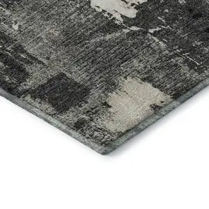Photo of Black And Ivory Abstract Washable Area Rug With UV Protection