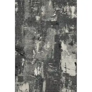 Photo of Black And Ivory Abstract Washable Area Rug With UV Protection