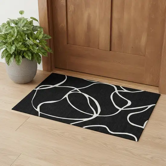 Black And Ivory Abstract Washable Area Rug With UV Protection Photo 1