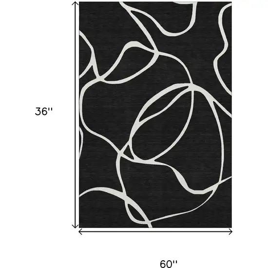 Black And Ivory Abstract Washable Area Rug With UV Protection Photo 8