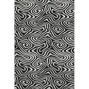 Photo of Black And Ivory Abstract Washable Area Rug With UV Protection