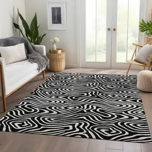 Photo of Black And Ivory Abstract Washable Area Rug With UV Protection