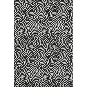 Photo of Black And Ivory Abstract Washable Area Rug With UV Protection