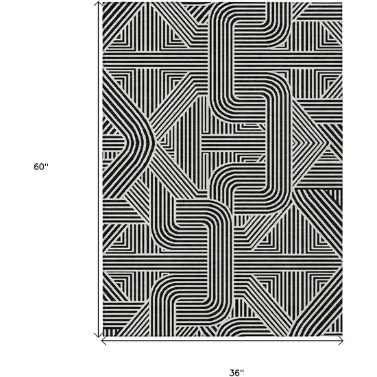 Black And Ivory Abstract Washable Indoor Outdoor Area Rug Photo 3