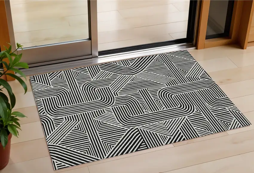 Black And Ivory Abstract Washable Indoor Outdoor Area Rug Photo 1