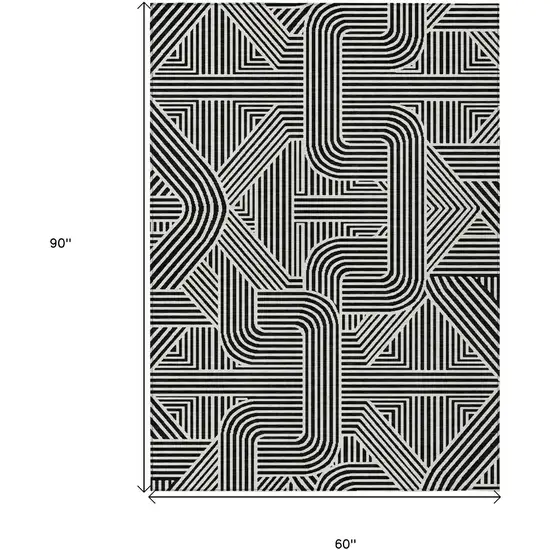 Black And Ivory Abstract Washable Indoor Outdoor Area Rug Photo 3