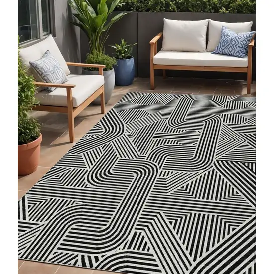 Black And Ivory Abstract Washable Indoor Outdoor Area Rug Photo 1