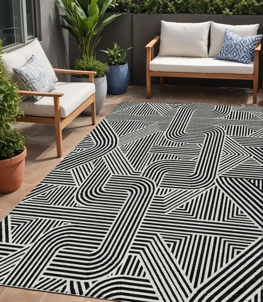 Black And Ivory Abstract Washable Indoor Outdoor Area Rug Photo 1