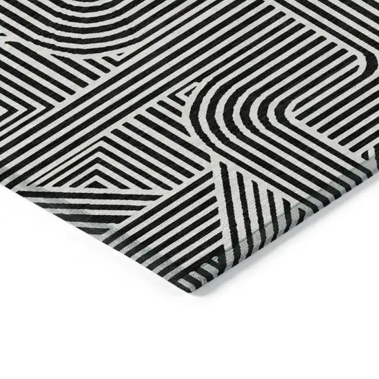 Black And Ivory Abstract Washable Indoor Outdoor Area Rug Photo 5
