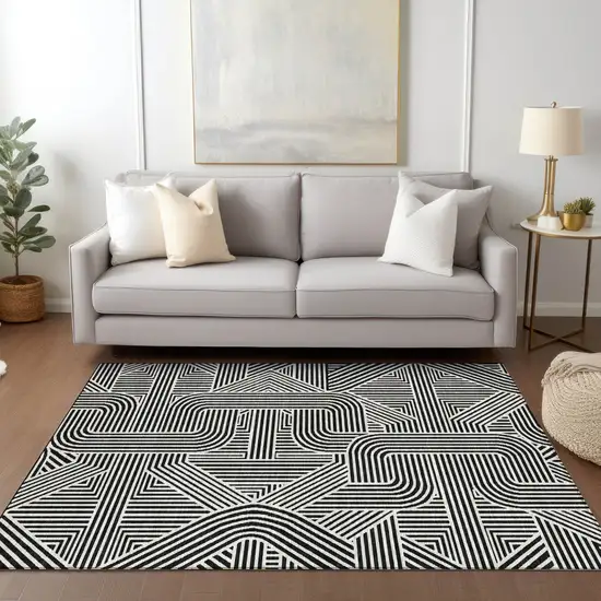Black And Ivory Abstract Washable Indoor Outdoor Area Rug Photo 9