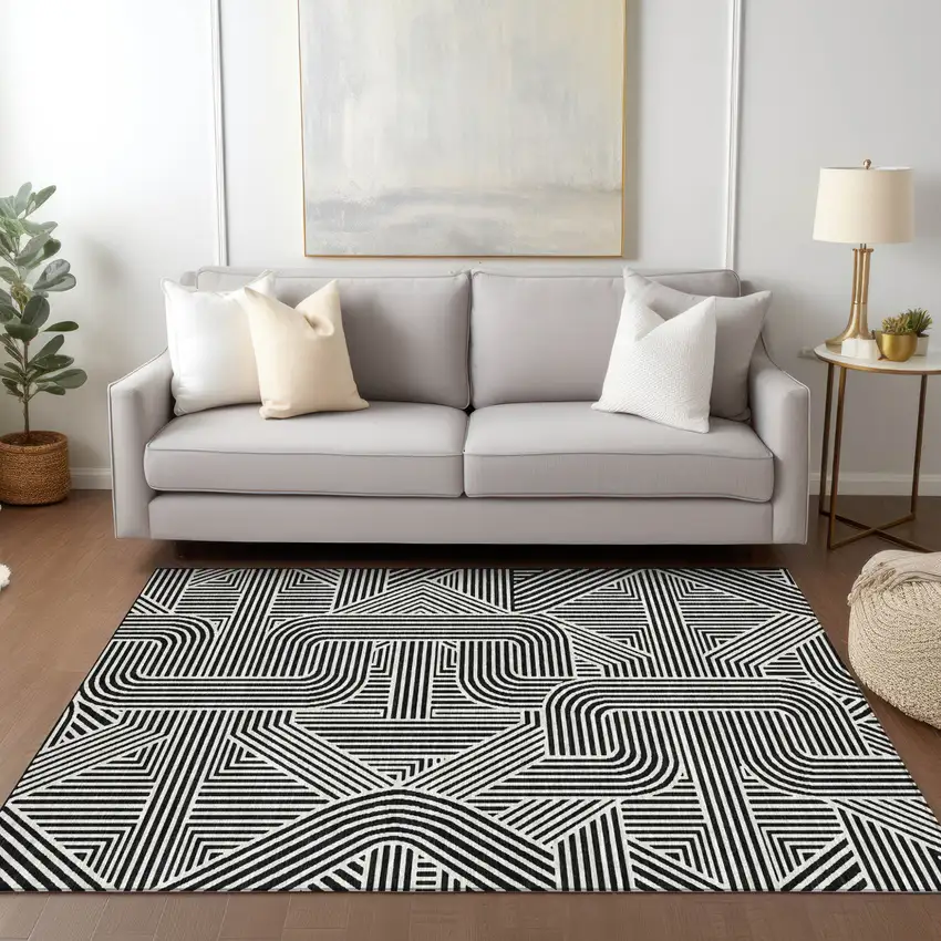 Black And Ivory Abstract Washable Indoor Outdoor Area Rug Photo 9