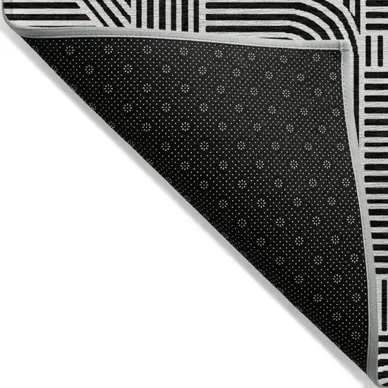 Black And Ivory Abstract Washable Indoor Outdoor Area Rug Photo 4