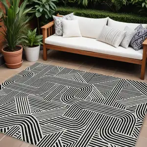 Photo of Black And Ivory Abstract Washable Indoor Outdoor Area Rug