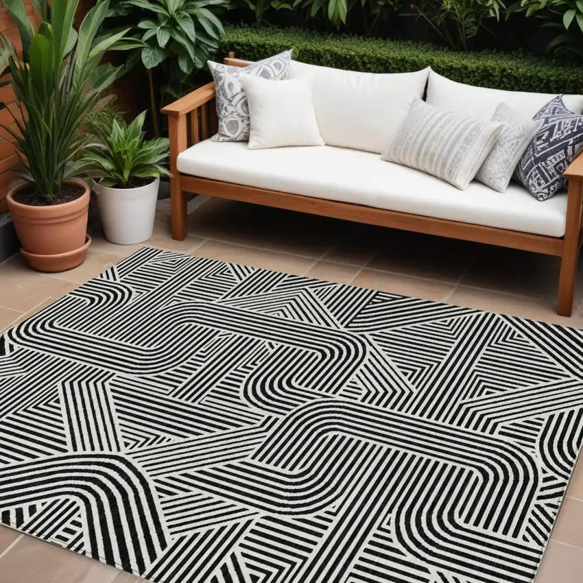 Black And Ivory Abstract Washable Indoor Outdoor Area Rug Photo 1