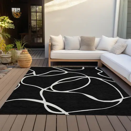Black And Ivory Abstract Washable Indoor Outdoor Area Rug Photo 8