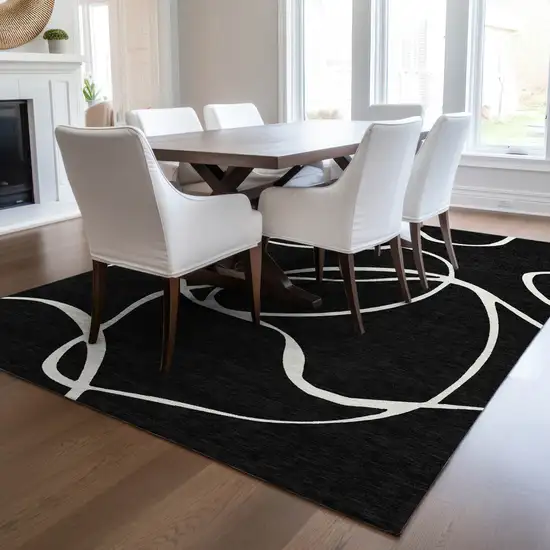 Black And Ivory Abstract Washable Indoor Outdoor Area Rug Photo 9