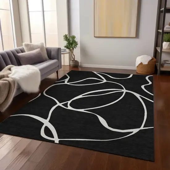 Black And Ivory Abstract Washable Indoor Outdoor Area Rug Photo 9