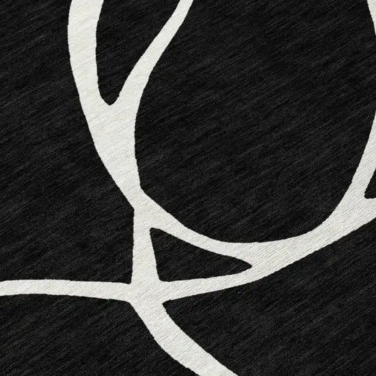 Black And Ivory Abstract Washable Indoor Outdoor Area Rug Photo 5