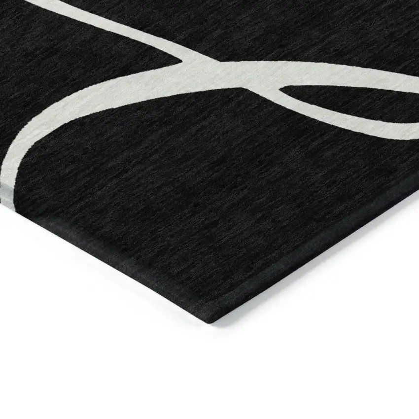 Black And Ivory Abstract Washable Indoor Outdoor Area Rug Photo 4