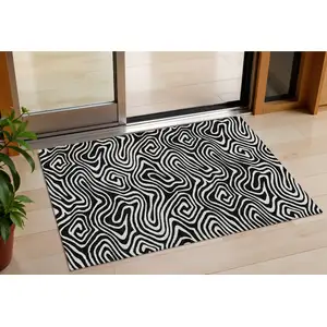 Photo of Black And Ivory Abstract Washable Indoor Outdoor Area Rug