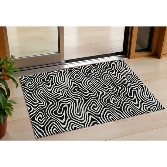 Black And Ivory Abstract Washable Indoor Outdoor Area Rug Photo 1
