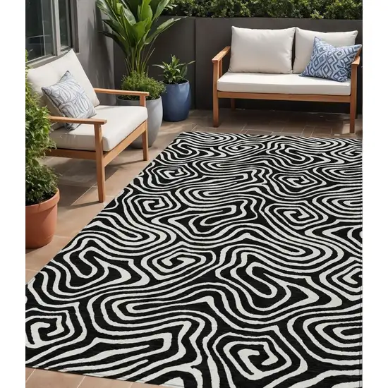 Black And Ivory Abstract Washable Indoor Outdoor Area Rug Photo 1
