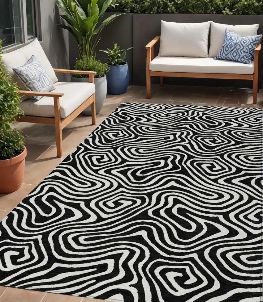 Black And Ivory Abstract Washable Indoor Outdoor Area Rug Photo 1
