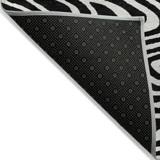 Black And Ivory Abstract Washable Indoor Outdoor Area Rug Photo 4