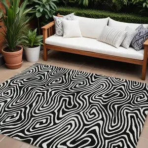 Photo of Black And Ivory Abstract Washable Indoor Outdoor Area Rug