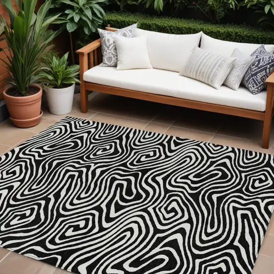 Black And Ivory Abstract Washable Indoor Outdoor Area Rug Photo 1
