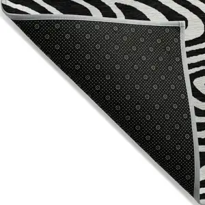 Photo of Black And Ivory Abstract Washable Indoor Outdoor Area Rug