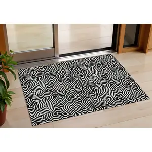 Photo of Black And Ivory Abstract Washable Indoor Outdoor Area Rug