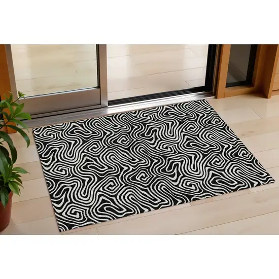 Black And Ivory Abstract Washable Indoor Outdoor Area Rug Photo 1