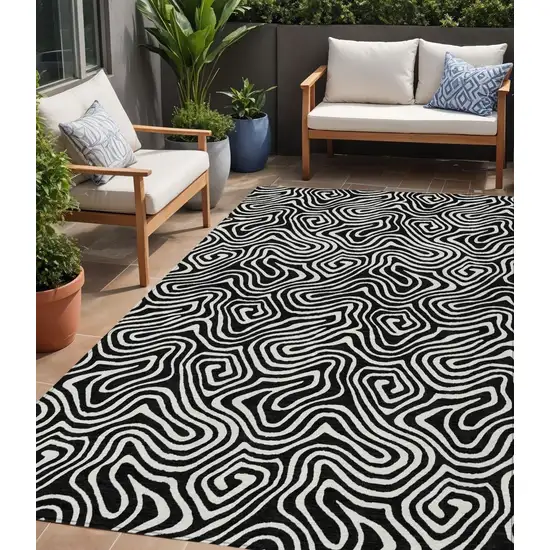 Black And Ivory Abstract Washable Indoor Outdoor Area Rug Photo 1