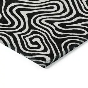Photo of Black And Ivory Abstract Washable Indoor Outdoor Area Rug