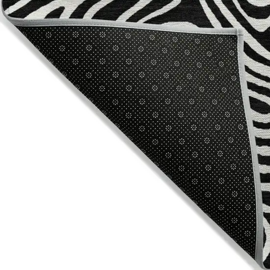 Black And Ivory Abstract Washable Indoor Outdoor Area Rug Photo 4