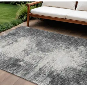 Photo of Black And Ivory Abstract Washable Indoor Outdoor Area Rug