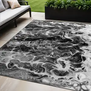 Photo of Black And Ivory Abstract Washable Indoor Outdoor Area Rug