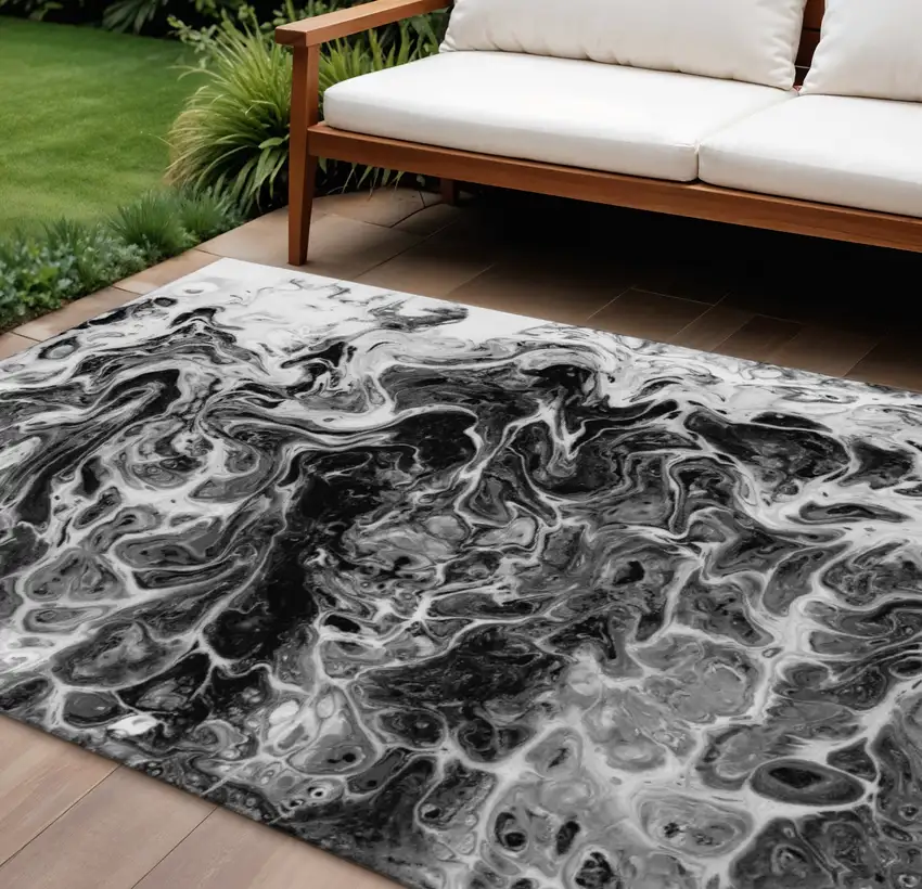 Black And Ivory Abstract Washable Indoor Outdoor Area Rug Photo 1