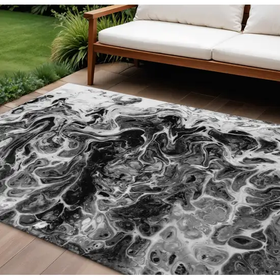 Black And Ivory Abstract Washable Indoor Outdoor Area Rug Photo 1