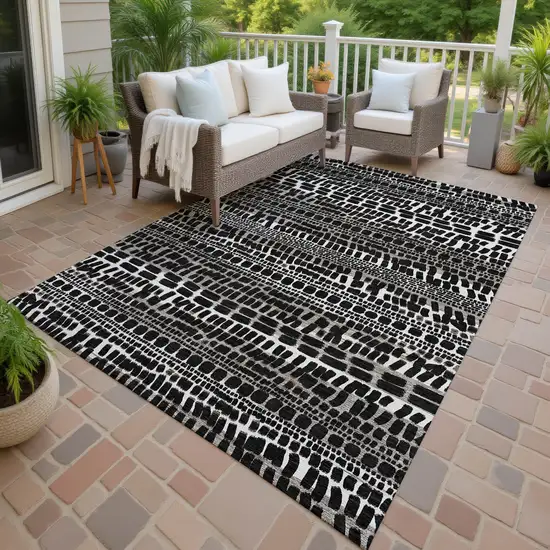 Black And Ivory Abstract Washable Indoor Outdoor Area Rug Photo 4
