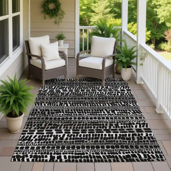 Black And Ivory Abstract Washable Indoor Outdoor Area Rug Photo 7