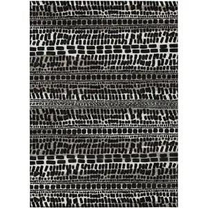 Photo of Black And Ivory Abstract Washable Indoor Outdoor Area Rug