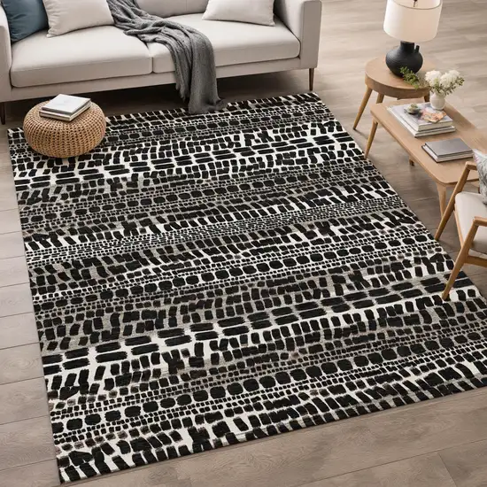 Black And Ivory Abstract Washable Indoor Outdoor Area Rug Photo 5