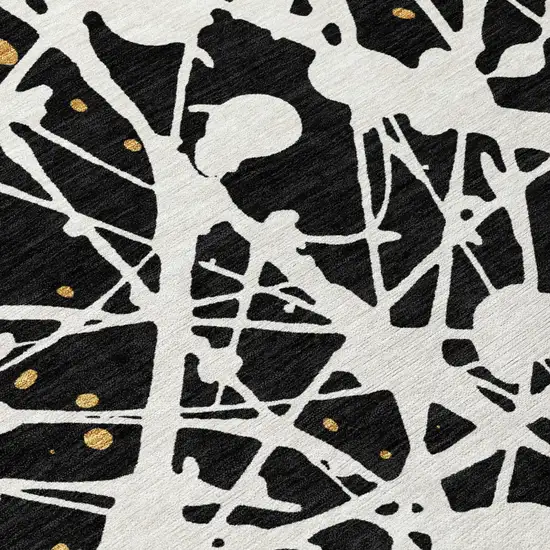 Black And Ivory Abstract Washable Indoor Outdoor Area Rug Photo 5