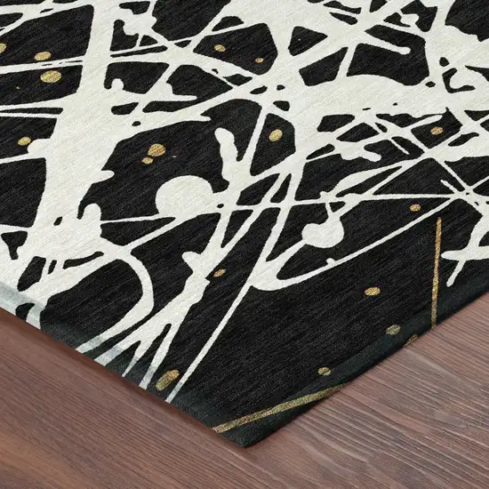 Black And Ivory Abstract Washable Indoor Outdoor Area Rug Photo 4